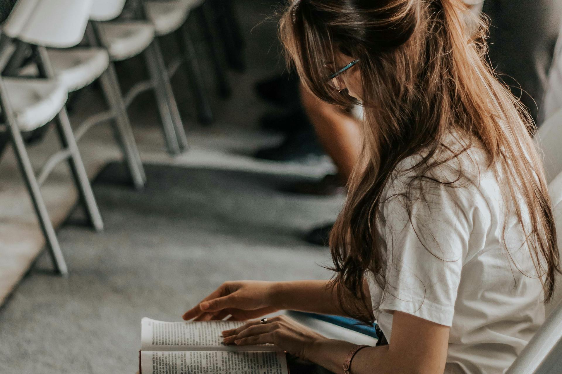 Woman reading and studying with focus